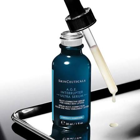 SkinCeuticals A.G.E. Interrupter Ultra Serum with dropper on a reflective surface